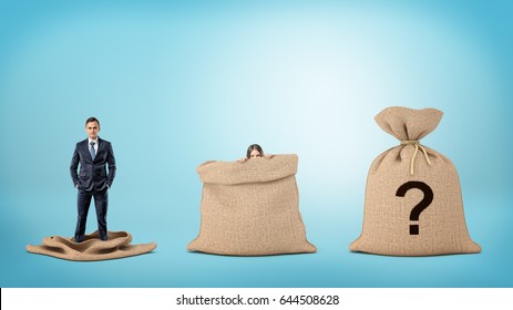 A Businessman In An Empty Sack And A Woman Behind An Open Sack, And One Sack Closed With A Question Mark. Unknown Market Players. Know Your Competition. Hidden Treasure.