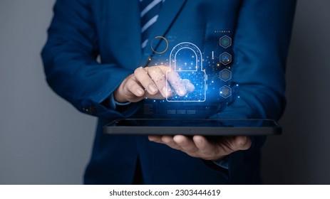 Businessman with encrypted hologram to enter business management system, encryption secure sensitive data, set password, protection of sensitive data. Encryption concept access data.