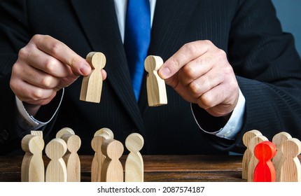 A businessman evaluates candidates for employment. Staff and Human Resource Management. Team building. Employment. Personnel selection. Staffing, recruiting and training workers. Appointment to posts - Shutterstock ID 2087574187