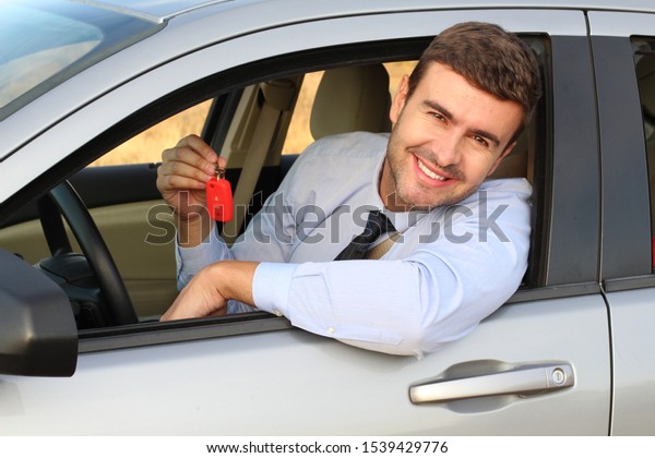 Businessman excited with his car\
