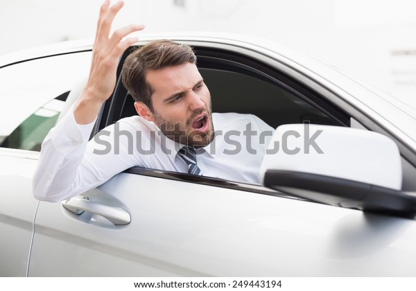 Businessman\
experiencing road rage in his\
car