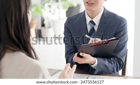 A businessman explaining a plan on a computer
