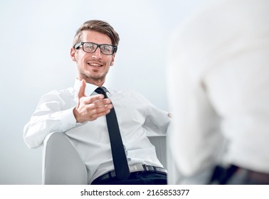 Businessman Explaining Something To His Colleague