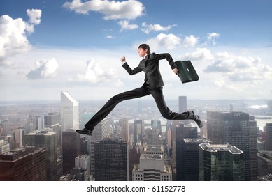 Businessman With Extreme Long Legs Jumping From A Skyscraper To Another