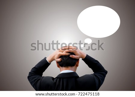 Businessman feeling headache and worry and thinking about his business and future with dialog box for text.