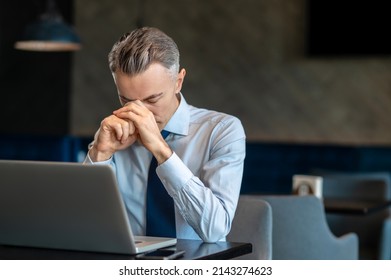 A Businessman Feeling Tired After Long Work