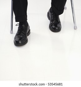 Businessman Feet Under Desk.