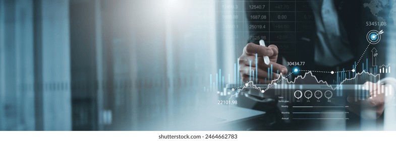 Businessman, finance analyst analyzing financial report, economic growth graph chart. Business strategy. planning and solution, risk management for business success, finance and investment background - Powered by Shutterstock