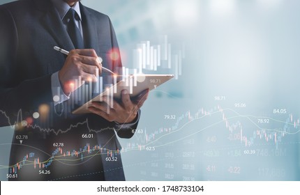 Businessman, Finance Analyst Using Digital Tablet Analyzing Financial Investment Data, Monitoring On Stock Market Report, Forex Graph, Business Planning And Strategy, Financial Background.
