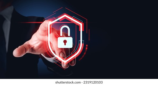 Businessman finger touch red glowing protective shield with padlock, dark background. Concept of cyber security, data protection and confidential information