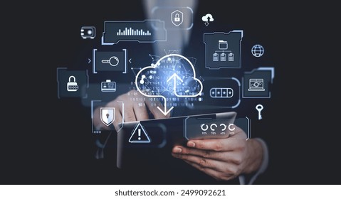 Businessman finger touch tablet in hands, cloud server with sync symbol hologram, digital folders with files, data storage and security. Concept of digital information, backup and transfer