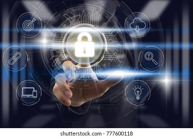 Businessman Finger touching the key icon for security access with technology icon over the light from blur server room background, Cyber Security Data Protection support Technology Privacy concept.