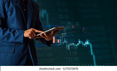 Businessman finger touching tablet with finance and banking profit graph of stock market trade indicator financial, Financial chart with up trend line graph. - Shutterstock ID 1175573470