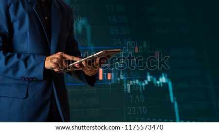 Businessman finger touching tablet with finance and banking profit graph of stock market trade indicator financial, Financial chart with up trend line graph.