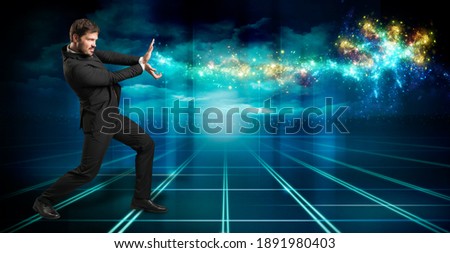 businessman firing sparkles like a superpower on blue background
