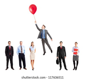 Businessman flying away from his team