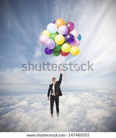Businessman flying high concept of success