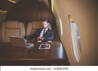 Businessman flying on his private jet