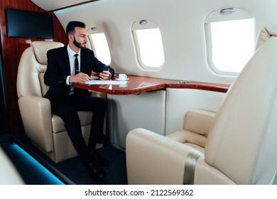  Businessman Flying On His Private Jet. Successful Business Man And Entrepreneur Flying To His Meeting. Famous Salesman And Speaker Going To A Sales Event