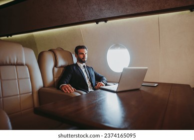 Businessman flying on his private jet - Powered by Shutterstock