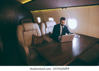 Businessman flying on his private jet - Powered by Shutterstock