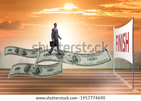 Businessman flying on hundred dollar banknote