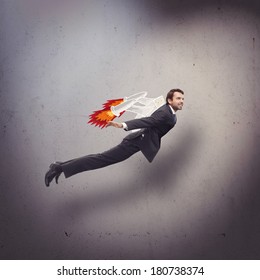 Businessman Flying With Rocket Backpack