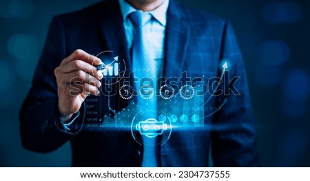 Businessman is focused on the growth sales data graph which is displayed on the screen, highlights data analysis to represent financial planning, investment, marketing strategy, business development