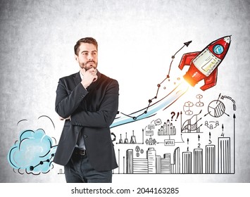 Businessman in formal suit is standing near colourful sketch with large rocket launch, business, plan, teamwork, bar and pie diagram on concrete wall. Concept of imagination for creative ideas - Powered by Shutterstock