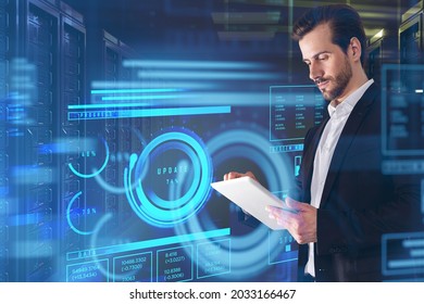 Businessman in formal suit is touching tablet with hologram of digital interface with words update, progress and data. Server room background. Concept of cloud data storage and information security
