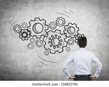 Businessman With Gears - A Concept Of Well Organized Work Process.