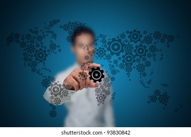 Businessman with the gears that drive the economy. - Powered by Shutterstock