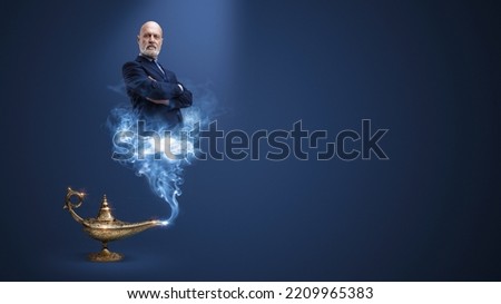 Businessman genie coming out from the lamp, he is posing with crossed arms, blank copy space Stok fotoğraf © 
