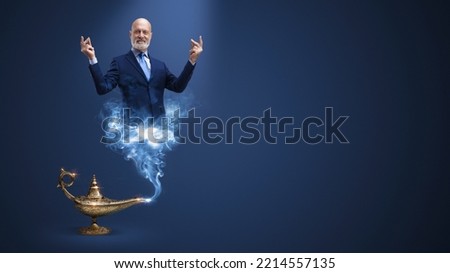 Businessman genie coming out from the lamp and snapping fingers, he is fulfilling wishes, blank copy space