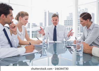 Businessman Gesturing During A Meeting As He Looks Angry
