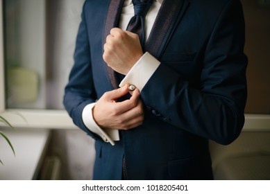 Businessman getting dressed in beautiful suite. Close up shot. - Shutterstock ID 1018205401
