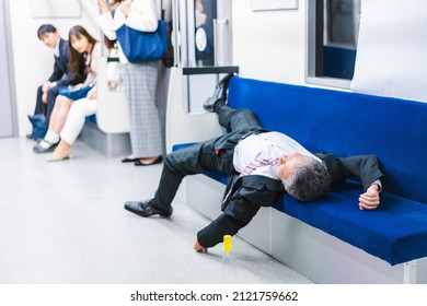 Businessman Getting Drunk On The Train