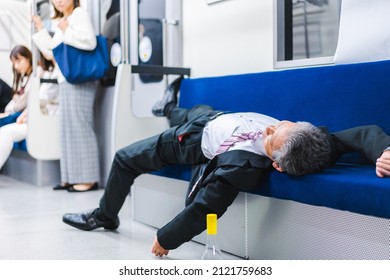 Businessman Getting Drunk On The Train