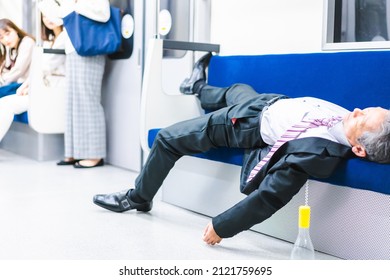 Businessman Getting Drunk On The Train