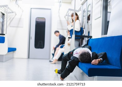 Businessman Getting Drunk On The Train