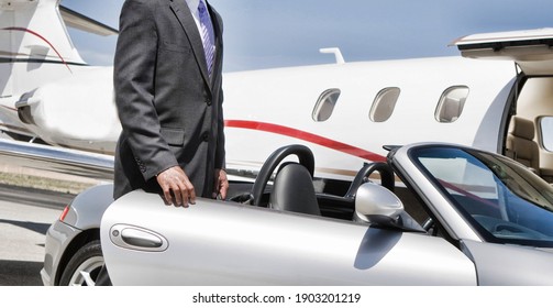 Businessman Getting On The Car Against Private Plane