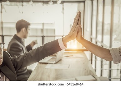 Businessman Giving Hi Five/ Touching Hands And Thumb Up During Meeting For Celebration Business Achievement And Success With Teamwork