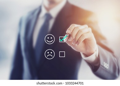 Businessman giving rating with happy icon, Customer satisfaction survey concept - Shutterstock ID 1033244701