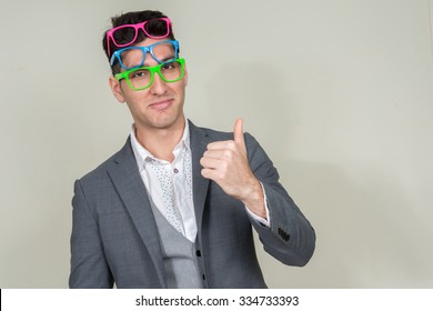 Businessman giving thumbs up - Powered by Shutterstock