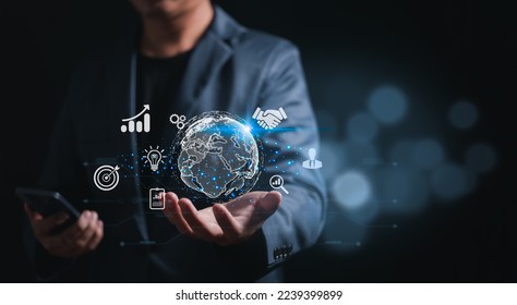 Businessman with global internet connections, application technology, and digital marketing. Using his mobile phone for business. Financial and banking, digital link technology, big data