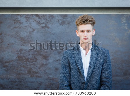 Businessman in gray coat. The concept of career and entrepreneurship.