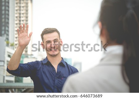 Businessman greet and say hello freind colleague in city outdoor