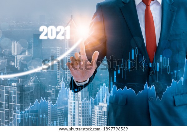 Businessman Growth success,using finger touch\
2021,stock graph and chart background,concept growth development\
business investment,Stock market,strategy making market plan,stock\
market fluctuation
