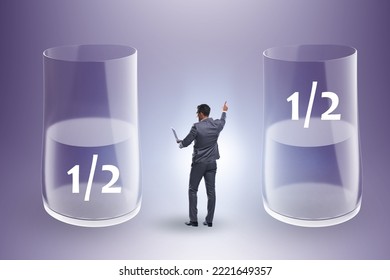 Businessman In Half Empty Half Full Glass Concept