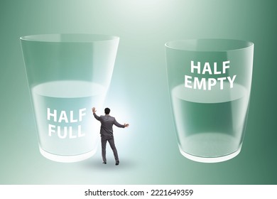 Businessman In Half Empty Half Full Glass Concept